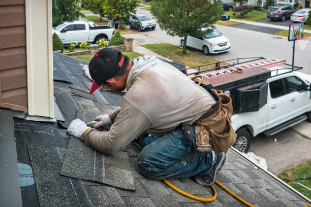 Professional Roof Leak Repair technician working in Adrian, MO